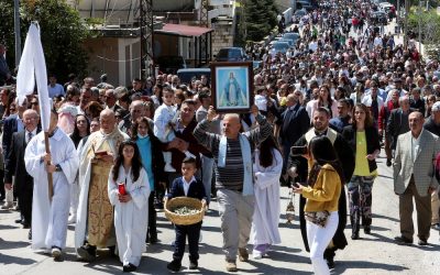 Lebanese Maronite Catholic priest Father Pierre al-Rahi, also known by his French name Pierre el-Raï, in vestments second from left, takes part in a Palm Sunday procession in Qlayaa, Lebanon, April 2, 2023. Father al-Rahi was killed in this village in southern Lebanon during an Israeli artillery tank fire on a house March 9, 2026. (OSV News photo/Aziz Taher, Reuters)