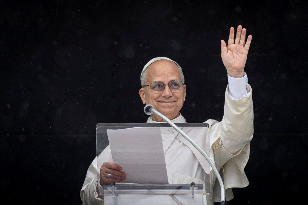 Pope Leo XIV waves as he leads the Angelus prayer from a window of the Apostolic Palace, at the Vatican, March 22, 2026. (OSV News/ Vatican Media, Matteo Pernaselci via Reuters)