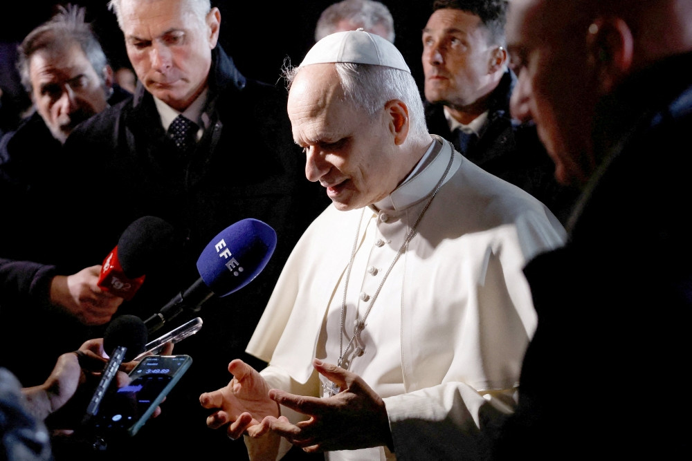 Pope Leo XIV speaks to the media before leaving the papal residence in Castel Gandolfo, Italy, March 31, 2026, to head back to the Vatican. Pope Leo called on world leaders, including President Donald Trump by name, to deescalate the war in the Middle East. (OSV News/Remo Casilli, Reuters)