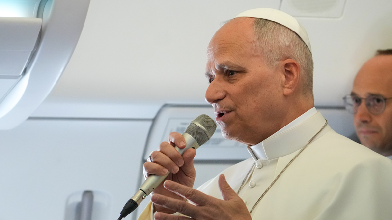 Pope Leo XIV speaks to reporters aboard the papal flight from Rome, Italy, to Algeria April 13, 2026. (CNS/Lola Gomez)