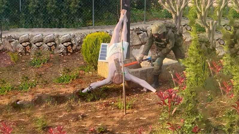 An Israeli soldier is seen destroying a statue of Jesus in Debel, Lebanon, April 19, 2026. The Israel Defense Force on April 19 confirmed the authenticity of the photo, which was posted on X by Palestinian journalist Younis Tirawi. (OSV News/x.com via Reuters)