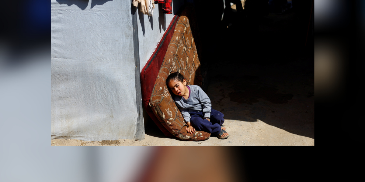 A child reacts March 11, 2026, in a tent camp in Deir al-Balah, in the central Gaza Strip. Large numbers of Palestinians continuously arrive in the refugee camp as Israel’s daily airstrikes and tank shelling continue to target what the Israel describes as Hamas infrastructure and militants, according to news reports. (OSV News/Mahmoud Issa, Reuters)