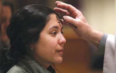 A young woman receives ashes during Ash Wednesday at Sacred Heart Church in Prescott, Arizona, as the season of Lent begins. (OSV News/Bob Roller/U.S.)