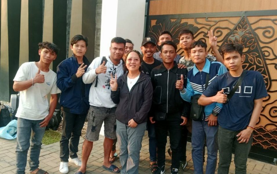 Maryknoll Lay Missioner Thu Tam “T.T.” Hoang (center) befriends 10 Indonesian migrant workers exploited in Cambodia. As the Cambodian government cracks down on scam operations, workers such as these — who had been lured from their home countries by the promise of better jobs — find themselves unemployed, abandoned and far from home. (Courtesy of Maryknoll Lay Missioners/Cambodia)