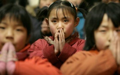 Children are pictured in a file photo praying during Mass at a Catholic church in a village at the outskirts of Taiyuan, China. Children “bear the brunt” of international religious freedom violations, panelists at an April 30, 2026, hearing of the U.S. Commission on International Religious Freedom said. (OSV News/Reinhard Krause, Reuters)