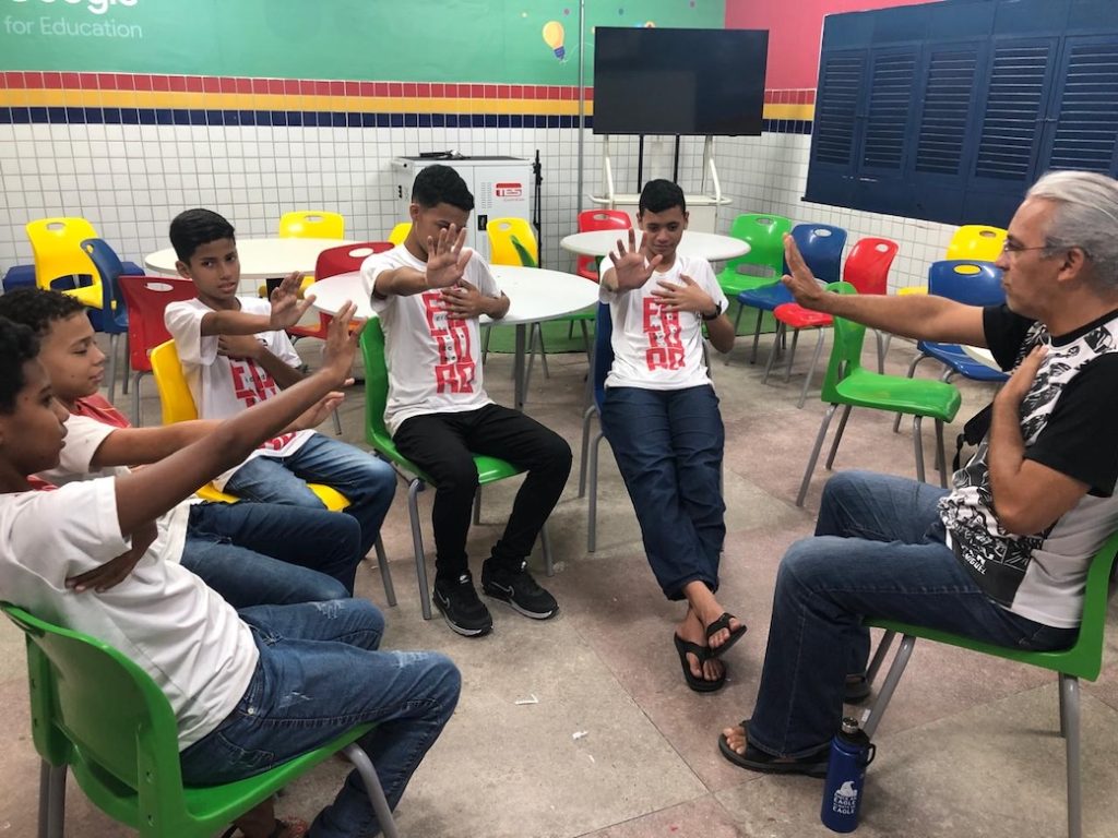 Maryknoll Lay Missioner Flávio José Rocha, the author’s husband, helps boys learn to manage their emotions through dynamics and exercises at Deputado Arnaldo School in João Pessoa, Brazil. (Courtesy of Kathleen Bond/Brazil)