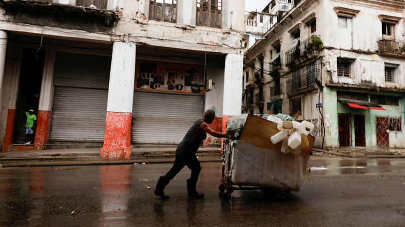 A man pushes a wheelbarrow loaded with collected plastic containers in Havana June 8, 2026. The Cuban government on June 18 announced far-reaching economic measures that could mark the most significant shift toward a market economy since the 1959 revolution. (OSV News/Norlys Perez, Reuters)