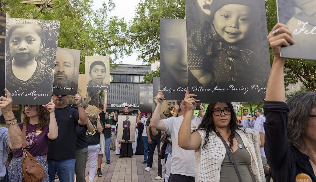 At a march and vigil March 24 attended by hundreds of people including five bishops, protestors hold posters of people who died in ICE detention or were killed by agents. The event, set on the date St. Óscar Romero was assassinated in 1980, was sponsored by the Diocese of El Paso and Hope Border Institute, in partnership with several other faith and community leaders. (Octavio Durán/U.S.)