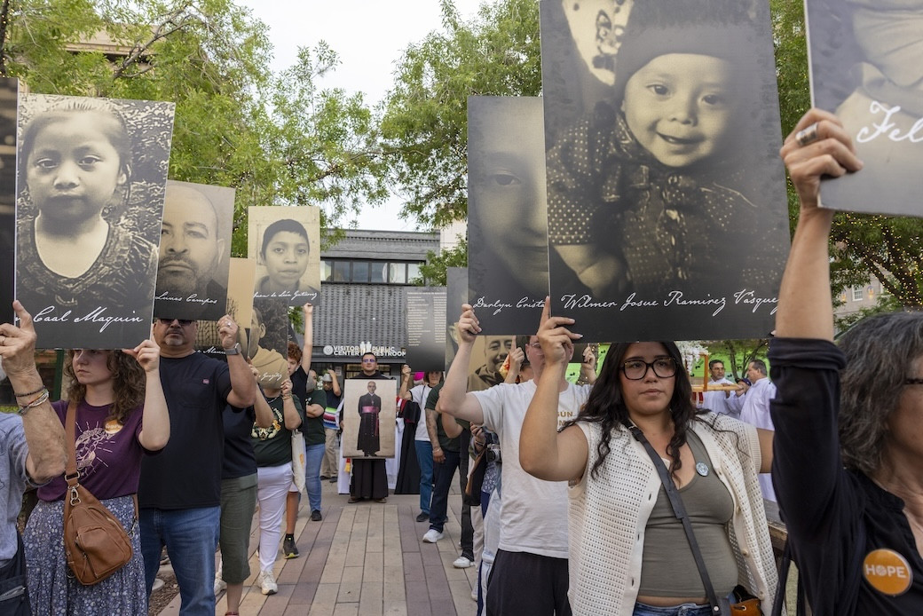 At a march and vigil March 24 attended by hundreds of people including five bishops, protestors hold posters of people who died in ICE detention or were killed by agents. The event, set on the date St. Óscar Romero was assassinated in 1980, was sponsored by the Diocese of El Paso and Hope Border Institute, in partnership with several other faith and community leaders. (Octavio Durán/U.S.)
