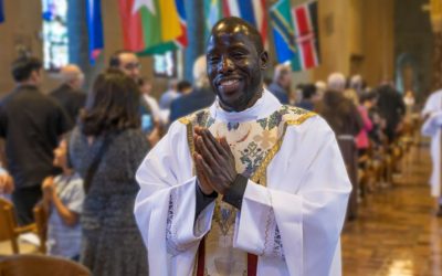 Maryknoll Father Victor Mutobera, ordained June 6 at the Maryknoll Society’s Our Lady Queen of Apostles Chapel in Ossining, New York, radiates joy as he leaves the chapel after the Mass of Holy Orders. Father Mutobera, who underwent eight years of preparation for the missionary priesthood, is assigned to serve in Tanzania. (Octavio Durán/U.S.)