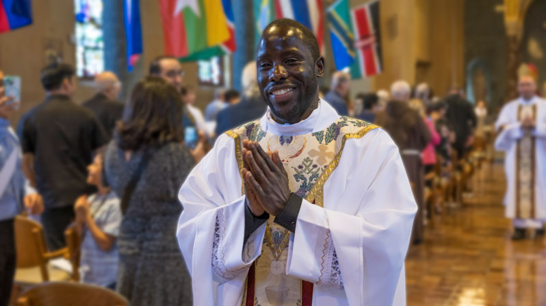 Maryknoll Father Victor Mutobera, ordained June 6 at the Maryknoll Society’s Our Lady Queen of Apostles Chapel in Ossining, New York, radiates joy as he leaves the chapel after the Mass of Holy Orders. Father Mutobera, who underwent eight years of preparation for the missionary priesthood, is assigned to serve in Tanzania. (Octavio Durán/U.S.)