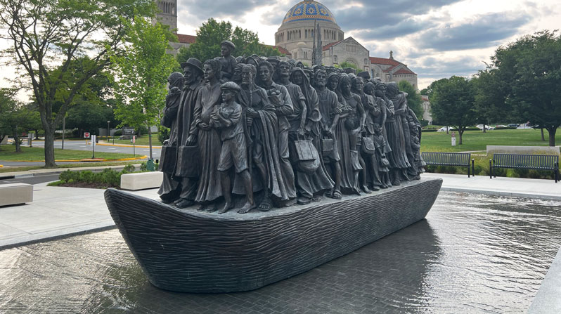The plight of migrants and refugees is represented on the Catholic University campus, Washington, D.C., in the sculpture “Angels Unawares” by Canadian artist Timothy Schmalz. (Lynn Monahan/U.S.)