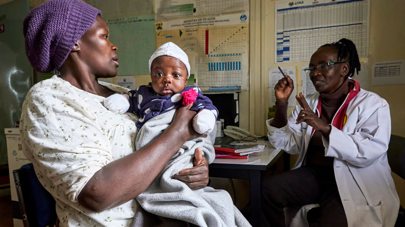 ernine Owour holds her 10-week old daughter, Rylie Willow, as Nurse Nancy Mwai vaccinates the child in the Mathare clinic of the Eastern Deanery AIDS Relief Program in Nairobi, Kenya. Owour has been HIV positive since 2013, but takes antiretroviral medication provided by the clinic that prevents mother-to-child transmission of the virus, allowing children like Rylie Willow to grow up HIV free. (Paul Jeffrey/Kenya)