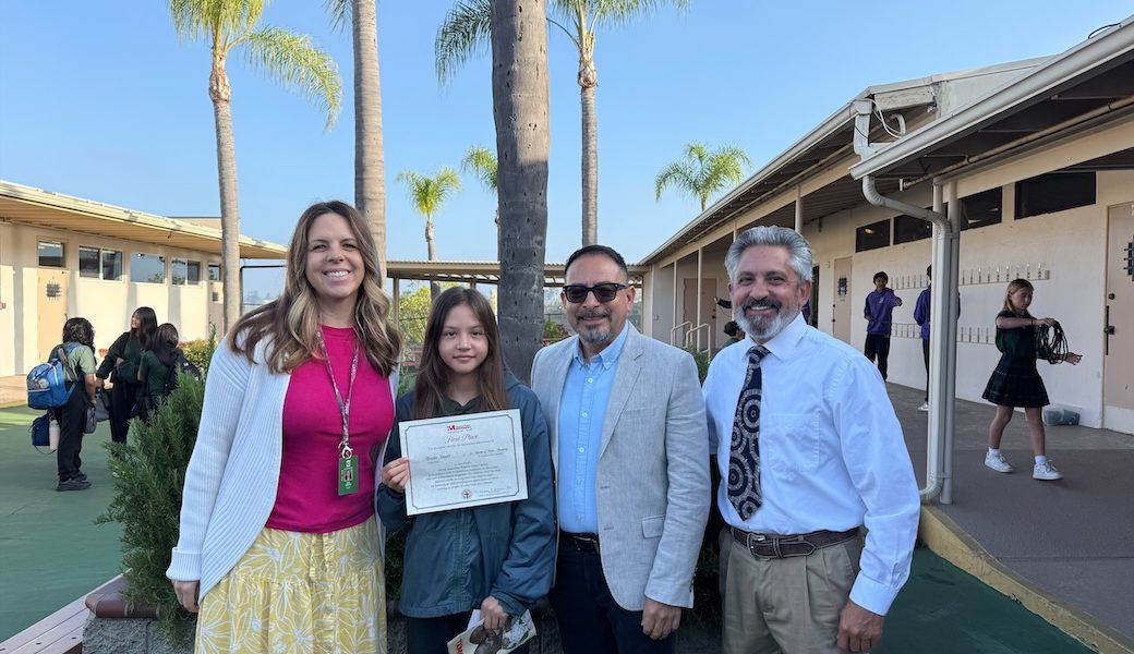 Avalin Shafer, shown with her teacher Katie Morland, Maryknoll’s Deacon Leonel Yoque (wearing glasses) and her principal Jamie Brandt (wearing tie), won the Bishop Francis X. Ford Award for Division I. Avalin attends St. Martin of Tours Academy in La Mesa, California. (Courtesy of Leonel Yoque/U.S.)