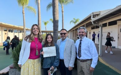 Avalin Shafer, shown with her teacher Katie Morland, Maryknoll’s Deacon Leonel Yoque (wearing glasses) and her principal Jamie Brandt (wearing tie), won the Bishop Francis X. Ford Award for Division I. Avalin attends St. Martin of Tours Academy in La Mesa, California. (Courtesy of Leonel Yoque/U.S.)