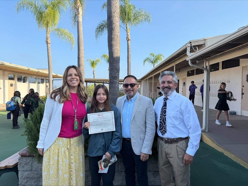 Avalin Shafer, shown with her teacher Katie Morland, Maryknoll’s Deacon Leonel Yoque (wearing glasses) and her principal Jamie Brandt (wearing tie), won the Bishop Francis X. Ford Award for Division I. Avalin attends St. Martin of Tours Academy in La Mesa, California. (Courtesy of Leonel Yoque/U.S.)