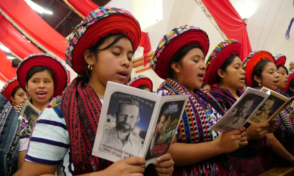 Tz’utujil women sing during the Mass celebrating Father Rother’s beatification, recalling the priest’s words, “The shepherd cannot run at the first sign of danger,” a statement that reflects his unwavering commitment to his people during one of Guatemala’s darkest history. (Sean Sprague/Guatemala)