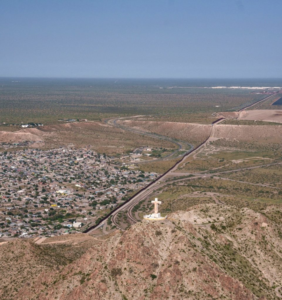 An aerial view shows a cross atop Mount Cristo Rey near the U.S.-Mexico border in Sunland Park, New Mexico. The Diocese of Las Cruces called plans to seize land from the pilgrimage site for a sector of the border wall an “affront to religious liberty” in a June 19 opposition response filed in U.S. District Court for the District of New Mexico. (OSV News/Paul Ratje, Reuters)