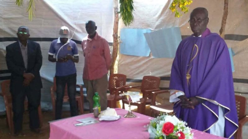 Father Youhanna Al-Amin is seen celebrating Mass in Sudan in an undated photograph. Catholic leaders in Sudan are renewing calls to end violence against civilians after the killing of Father Al-Amin, a priest serving in the Diocese of El-Obeid. Father Al-Amin was shot and killed June 19 in Kauda, in the Nuba Mountains, just as he was preparing to evacuate because of worsening insecurity. Two security guards were shot alongside him; one was killed, and one survived. (OSV News/courtesy ACN)