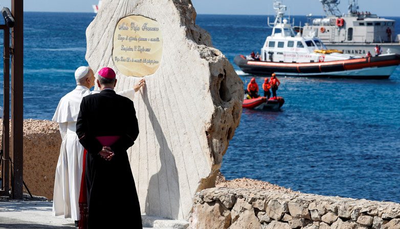 Pope Leo XIV blesses a plaque at the Favaloro Pier in Lampedusa, Italy, and dedicates the pier to Pope Francis during his visit to the island—a key entry point for migrants crossing the Mediterranean Sea—as part of a pastoral trip on July 4, 2026. (OSV News/Reuters, Remo Casilli)