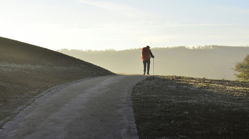 A pilgrim undertakes the journey to Santiago de Compostela in Spain. (Jorge Luis Ojeda Flota, available in the public domain through Unsplash)