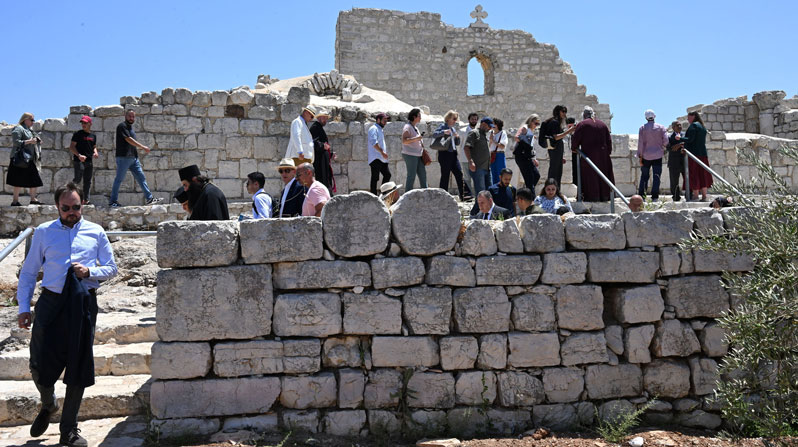 Diplomats, priests and journalists visit the fifth-century St. George Church during a solidarity visit with the patriarchs and heads of churches of Jerusalem to the Palestinian Christian town of Taybeh, West Bank, July 14, 2025. The visit took place in response to the July 7 attack when radical Israeli settlers set fire near the village cemetery and the church. (OSV News/Debbie Hill)
