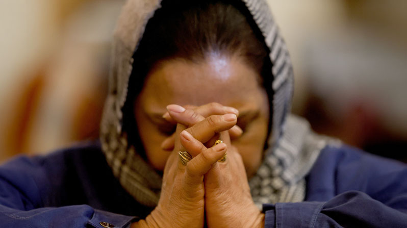 A woman prays during Christmas Eve Mass at Holy Family Catholic Church in Srinagar, India, Dec. 24, 2025. (OSV News/Sharafat Ali, Reuters)