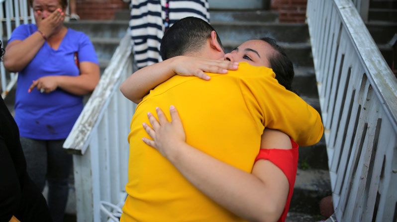 A file photo shows a teenage girl from El Salvador being embraced by a family friend before leaving Vive La Case refugee center with her family in Buffalo, New York, to file a claim with customs officials at the U.S.-Canadian border to remain in the United States. Hundreds of faith leaders and organizations urged the Trump administration to extend Temporary Protected Status (TPS) for El Salvador before it expires in September 2026. (OSV News/Chris Helgren, Reuters)