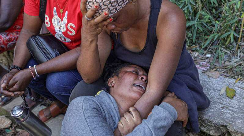 Women mourn near the bodies of people in Kenscoff, Haiti, on the outskirts of Port-au-Prince, killed during an overnight raid by an armed gang. A powerful gang coalition attacked a once peaceful farming community nestled in the hills above Haiti’s capital late Aug. 23, killing at least 47 and kidnapping 50. (OSV News/Patrice Noel, Reuters)