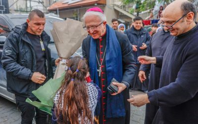 Auxiliary Bishop William Shomali of the Latin Patriarchate of Jerusalem, center, and Father Gabriel Romanelli, pastor of Gaza City’s Holy Family Parish in Gaza City, right, greet children as Cardinal Pierbattista Pizzaballa, Latin patriarch of Jerusalem, visits the church compound during his Christmas pastoral visit Dec. 15, 2025. The school at Holy Family Parish reopens in fall 2026 for the first time since the start of Israel’s military campaign. (OSV News/courtesy Latin Patriarchate of Jerusalem)