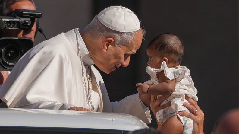 Pope Leo XIV greets a child from the popemobile while riding around St. Peter’s Square at the Vatican before his weekly general audience Sept. 2, 2026. (CNS/Lola Gomez)