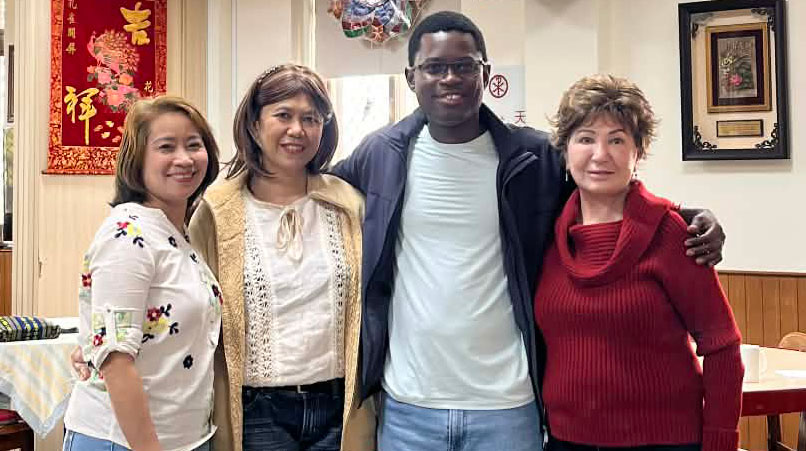 Maryknoll short-term volunteer Antonia Soave, far right, and Maryknoll Seminarian Paschal Madukwa, who is completing overseas mission training in Taiwan, enjoy an outing with Filipina migrant workers Mercy and Precious. (Courtesy of Antonia Soave/Taiwan)