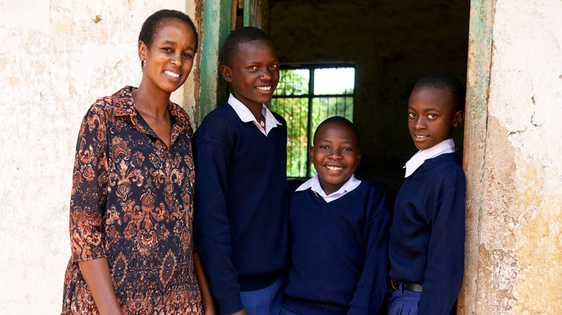 Instead of seeking a higher-paying job at a private school, Loyce Veryser chooses to work at a public school where, among other roles, she monitors students’ progress. (Paul Jeffrey/Tanzania)