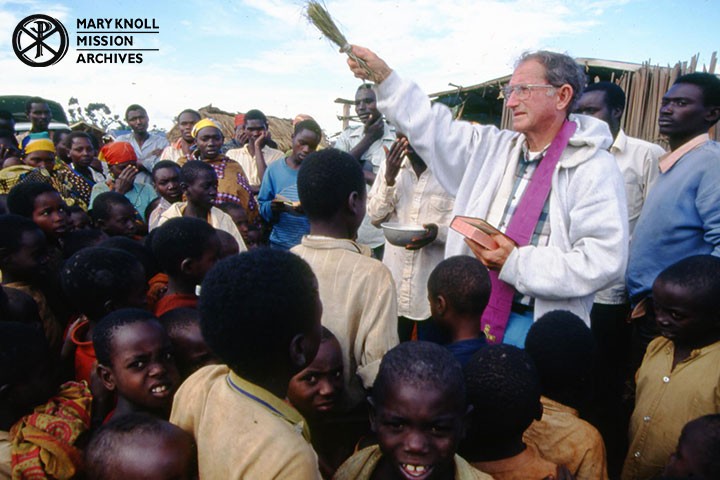 Fr. Dan Ohmann in a refugee camp in Tanzania conducting a service