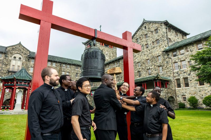 Newly ordained priests and seminarians ringing the Mission Bell on the Maryknoll campus.