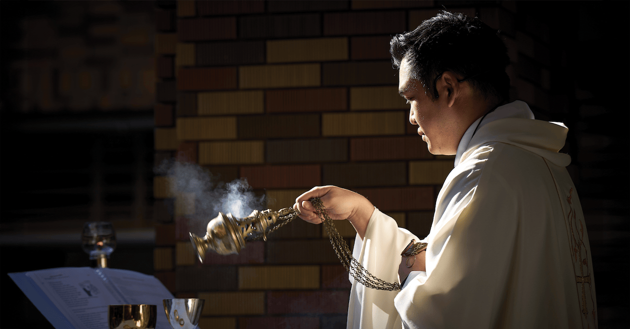 Father Daniel Kim, M.M. conducting mass