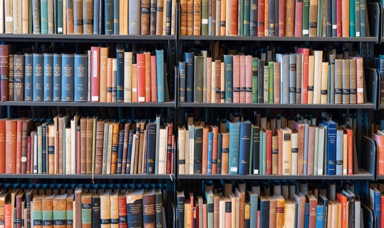 A bookshelf full of colorful books.