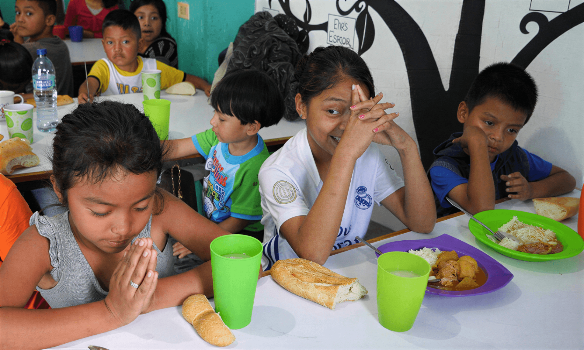 Children eat lunch at the soup kitchen at the Parish of Cristo Resucitado in Chile