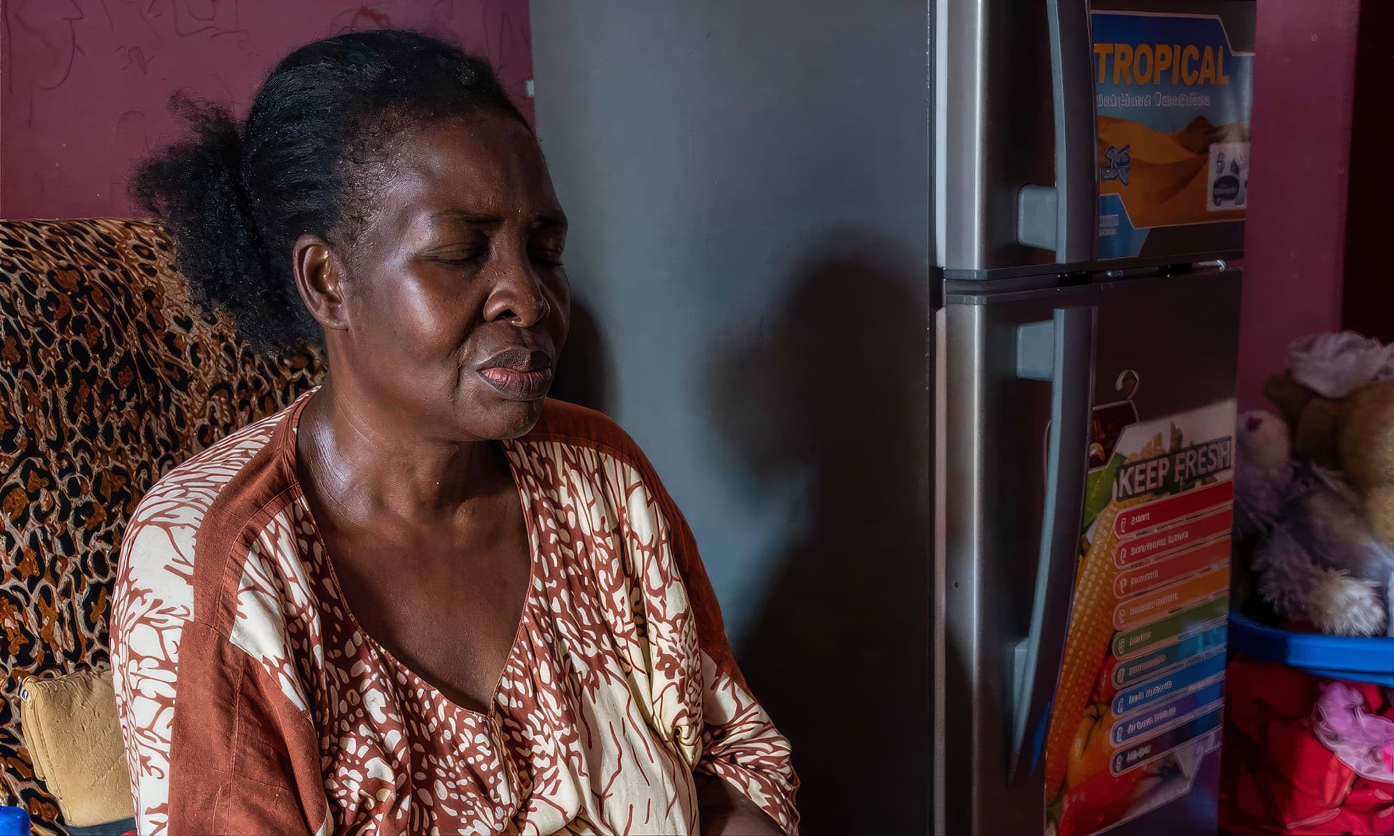 A woman sitting in a chair awaiting medical care from the Eastern Deanery